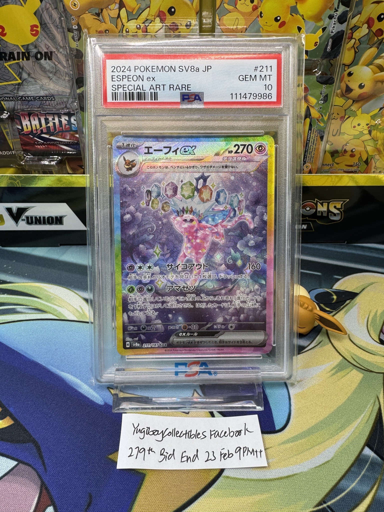 Espeon PSA auction reference with handwritten bid ending note